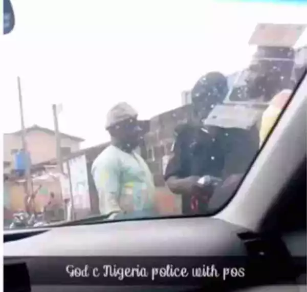 Nigerian policeman caught extorting money from a bike man using POS (VIDEO)
